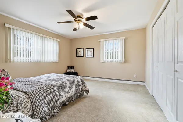 a bedroom with a bed and a couch