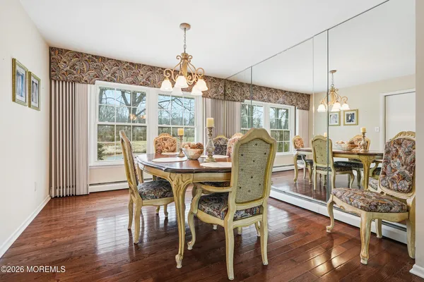 a view of a dining room with furniture window and wooden floor