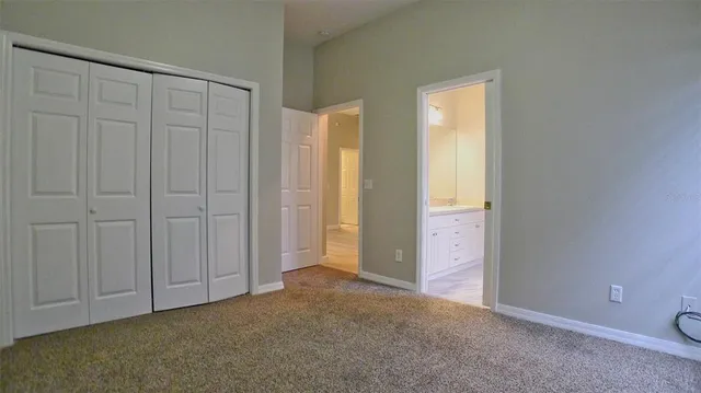 an empty room with closet area
