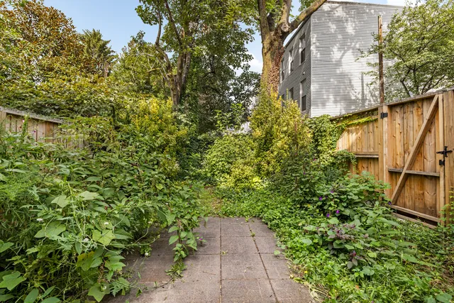 a bathroom with a bathtub sink and mirror