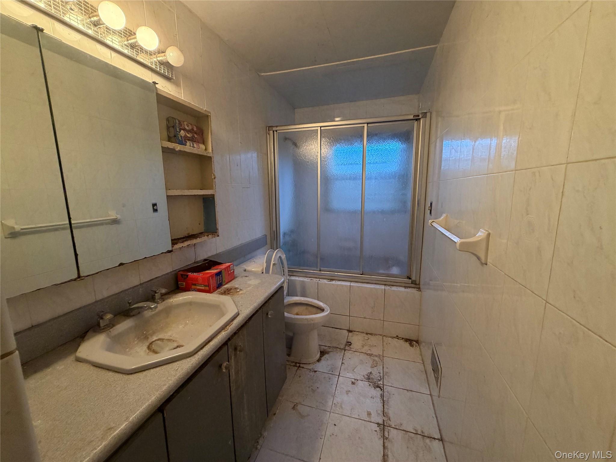 15 Bonnie Court Spring Valley, NY 10977 - Photo 7 of 22 a bathroom with a sink toilet and shower