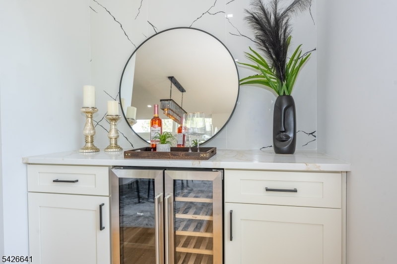 124 Wheatsworth Road Hamburg, NJ 07419 - Photo 17 of 50 a view of mirror with vase of flowers on it