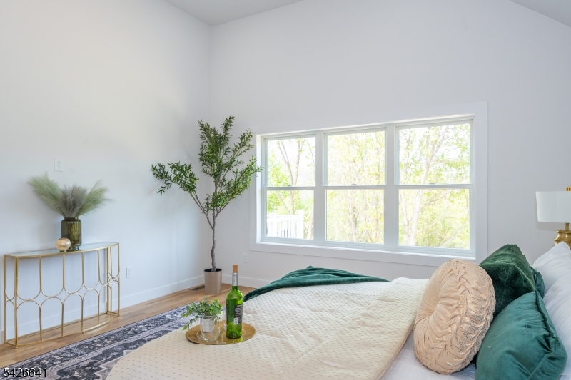 124 Wheatsworth Road Hamburg, NJ 07419 - Photo 25 of 50 a bed sitting in a bedroom next to a window