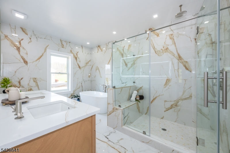 124 Wheatsworth Road Hamburg, NJ 07419 - Photo 28 of 50 a bathroom with a sink mirror and a shower