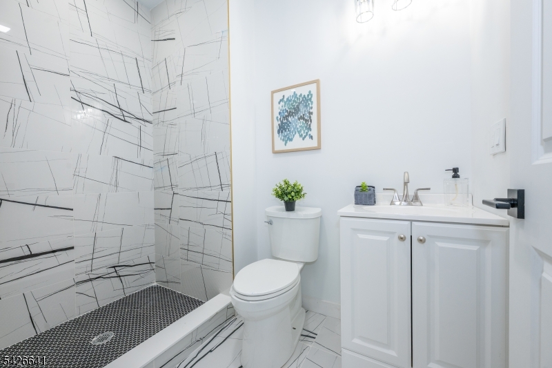 124 Wheatsworth Road Hamburg, NJ 07419 - Photo 35 of 50 a bathroom with a sink a toilet and shower