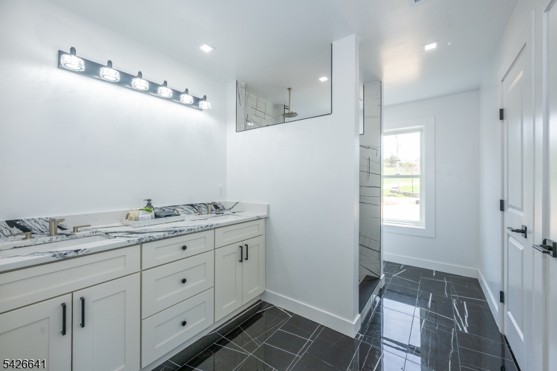 124 Wheatsworth Road Hamburg, NJ 07419 - Photo 37 of 50 a bathroom with a sink a vanity and a mirror