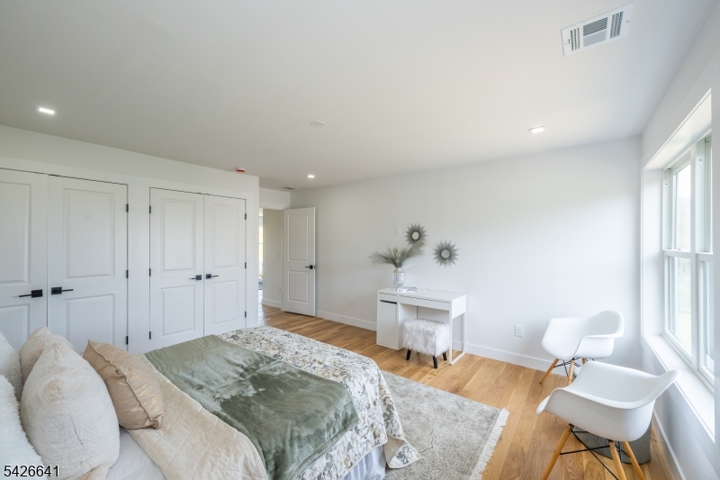 124 Wheatsworth Road Hamburg, NJ 07419 - Photo 41 of 50 a bedroom with a bed and a chair