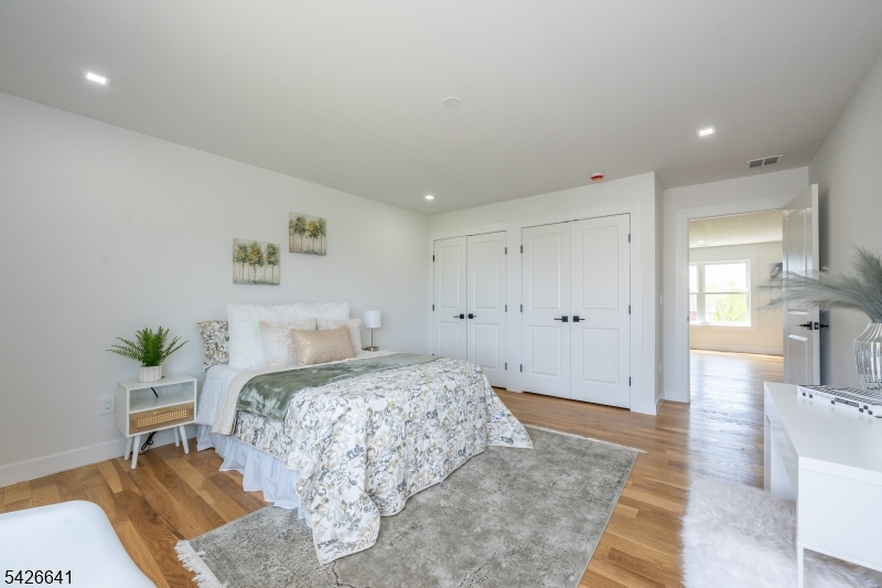 124 Wheatsworth Road Hamburg, NJ 07419 - Photo 42 of 50 a bedroom with a bed and a table in it