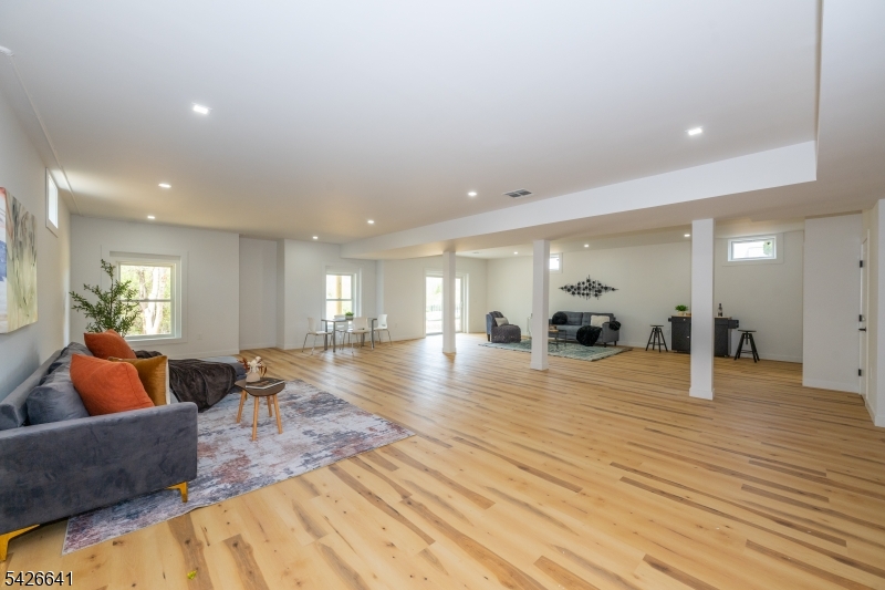124 Wheatsworth Road Hamburg, NJ 07419 - Photo 47 of 50 a large room with lots of furniture and wooden floor