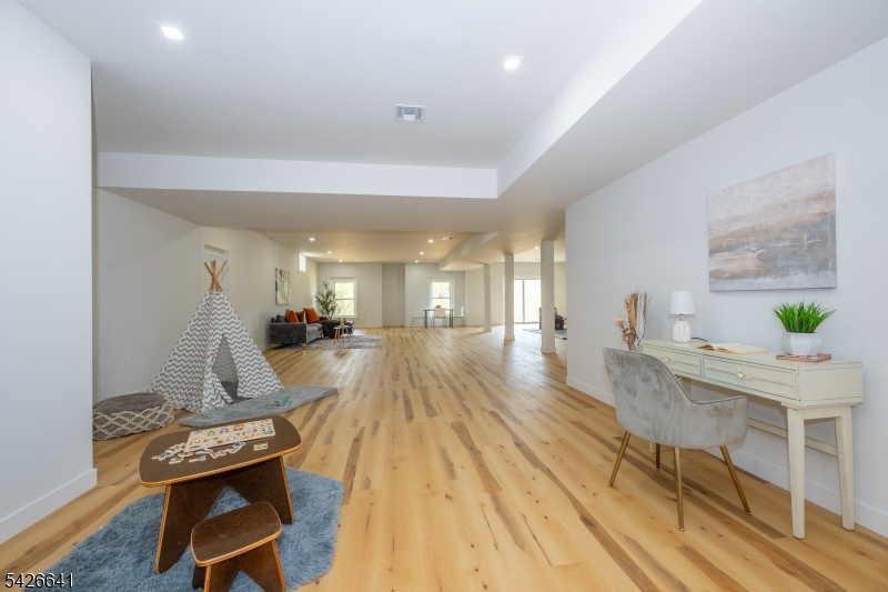 124 Wheatsworth Road Hamburg, NJ 07419 - Photo 49 of 50 a view of a room with furniture and wooden floor