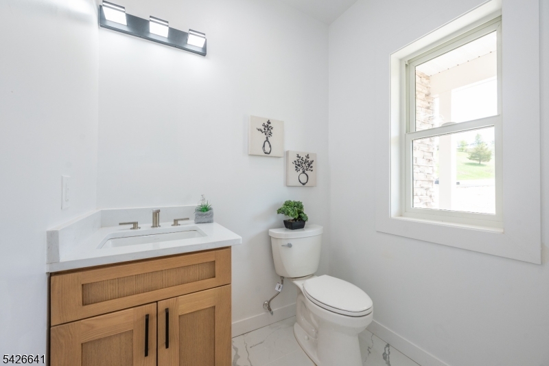 124 Wheatsworth Road Hamburg, NJ 07419 - Photo 9 of 50 a bathroom with a granite countertop toilet sink and mirror
