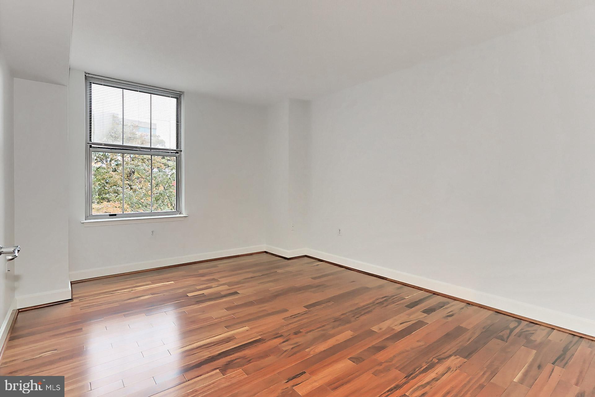 11800 Sunset Hills Road, Unit 513 Reston, VA 20190 - Photo 21 of 43 Primary bedroom with ensuite bath.