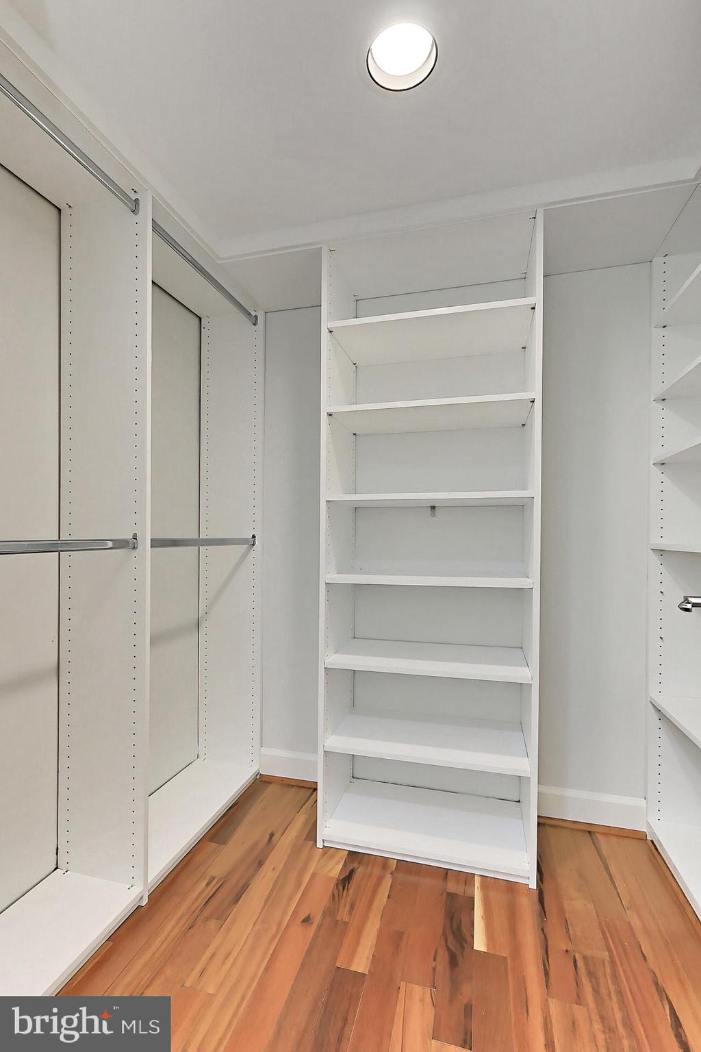 11800 Sunset Hills Road, Unit 513 Reston, VA 20190 - Photo 24 of 43 Walk-in closet in primary bedroom