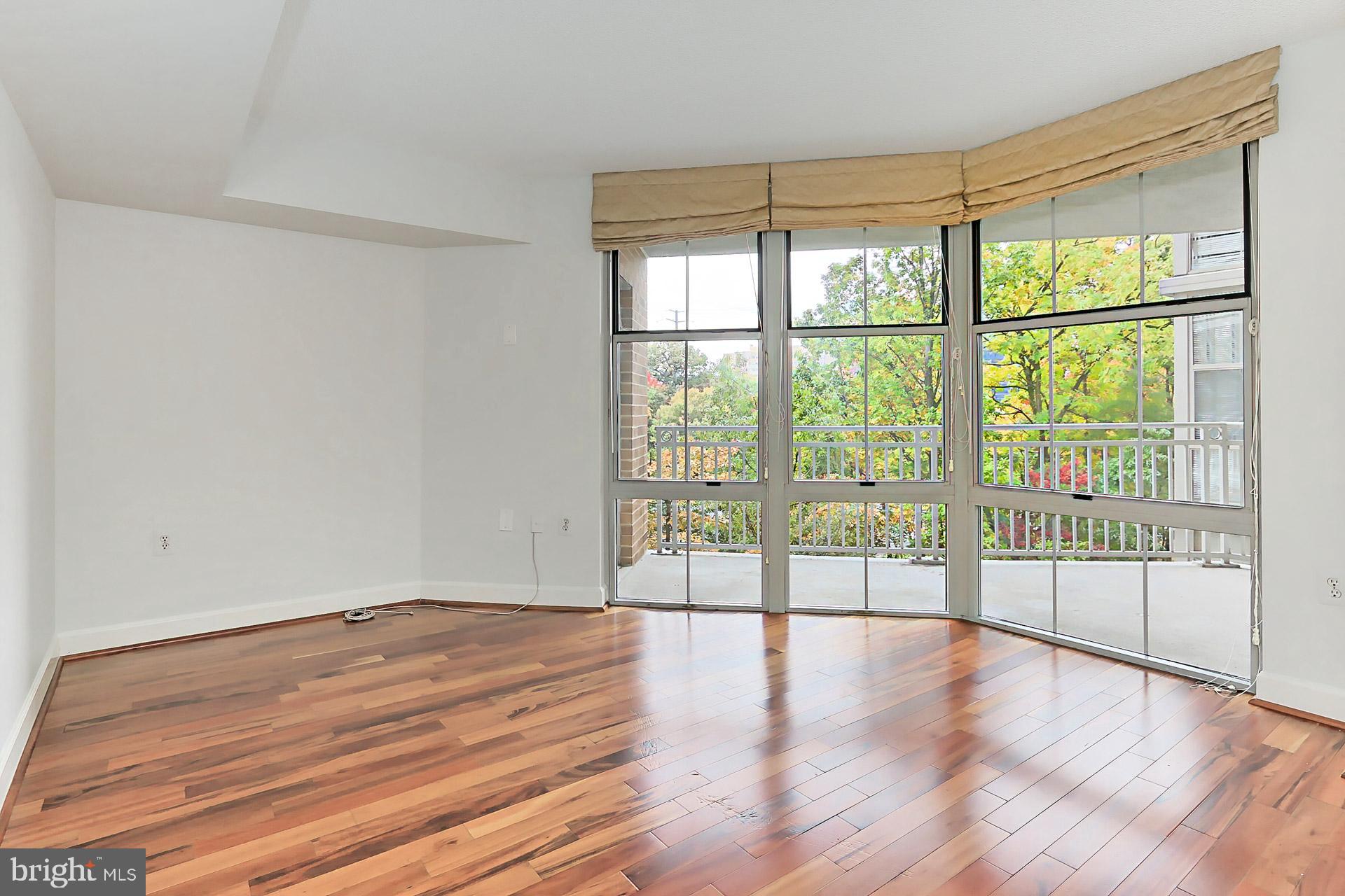 11800 Sunset Hills Road, Unit 513 Reston, VA 20190 - Photo 26 of 43 Secondary bedroom with floor to ceiling windows