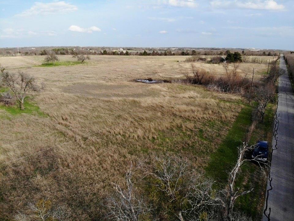 1900 Nesuda Road Ennis, TX 75119 - Photo 5 of 17 a view of a lake with houses in the back