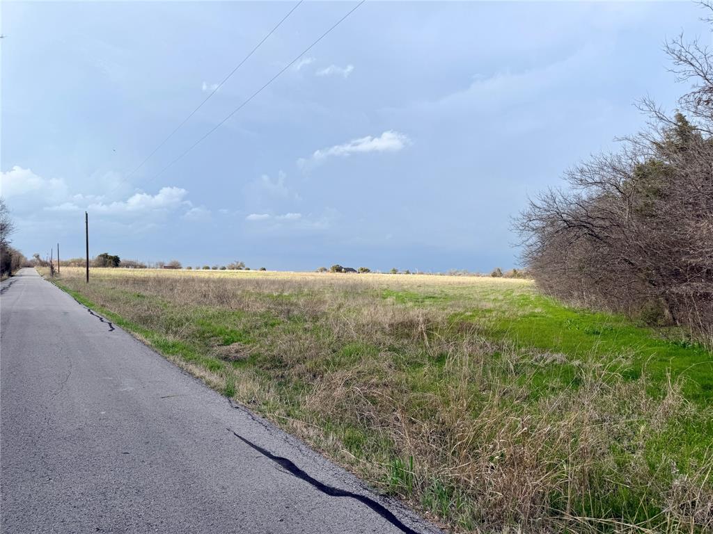 1900 Nesuda Road Ennis, TX 75119 - Photo 10 of 17 a view of a big yard with large trees
