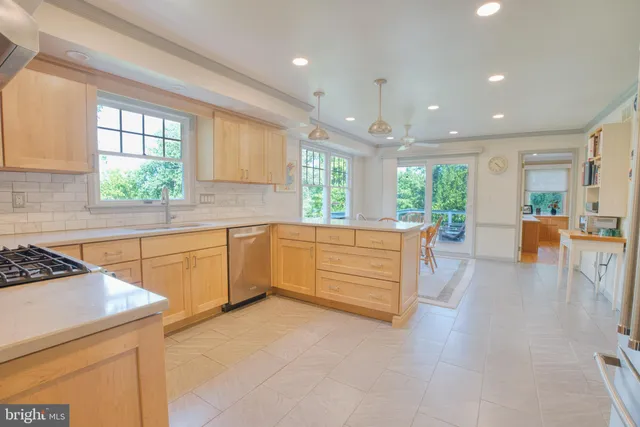 a living room with furniture and a dining table with wooden floor