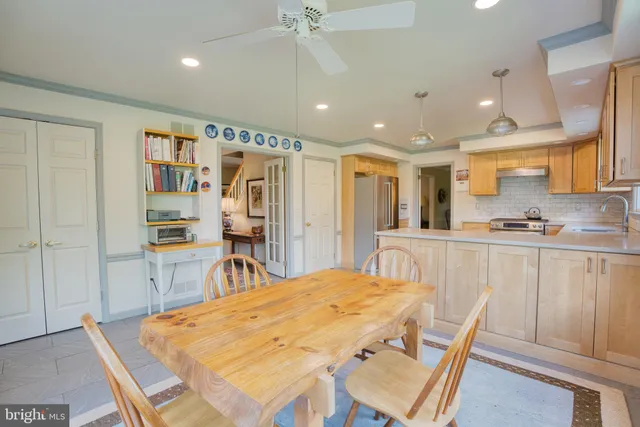 a bathroom with a sink a mirror a toilet and a mirror