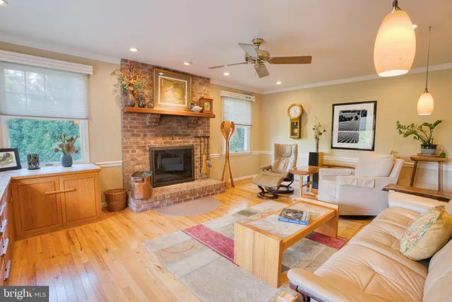 a spacious bedroom with a bed and wooden floor