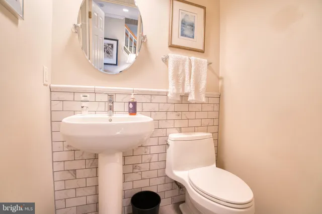 a bathroom with a toilet sink and a shower