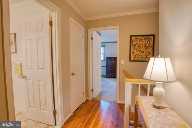 a bathroom with a granite countertop sink mirror vanity and toilet