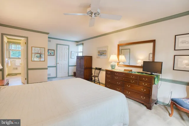 a bedroom with a bed and a lamp