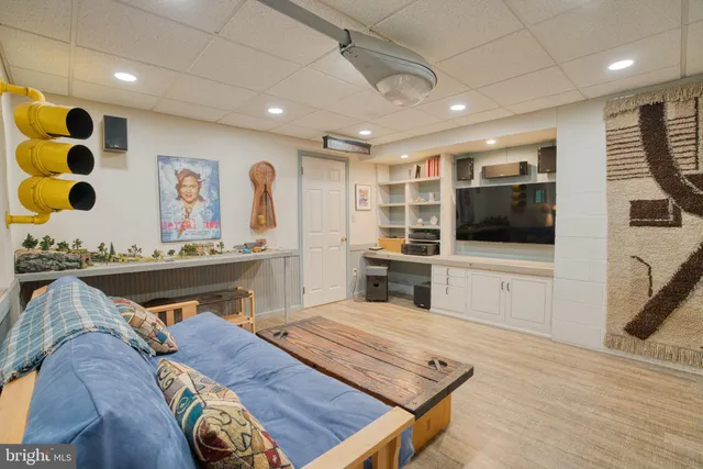 a view of a big yard with plants and large trees