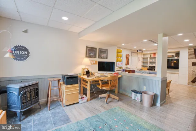 a view of a house with a yard and sitting area