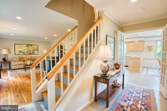 a living room with wooden floor and furniture