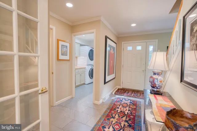 a living room with dining room and wooden floor
