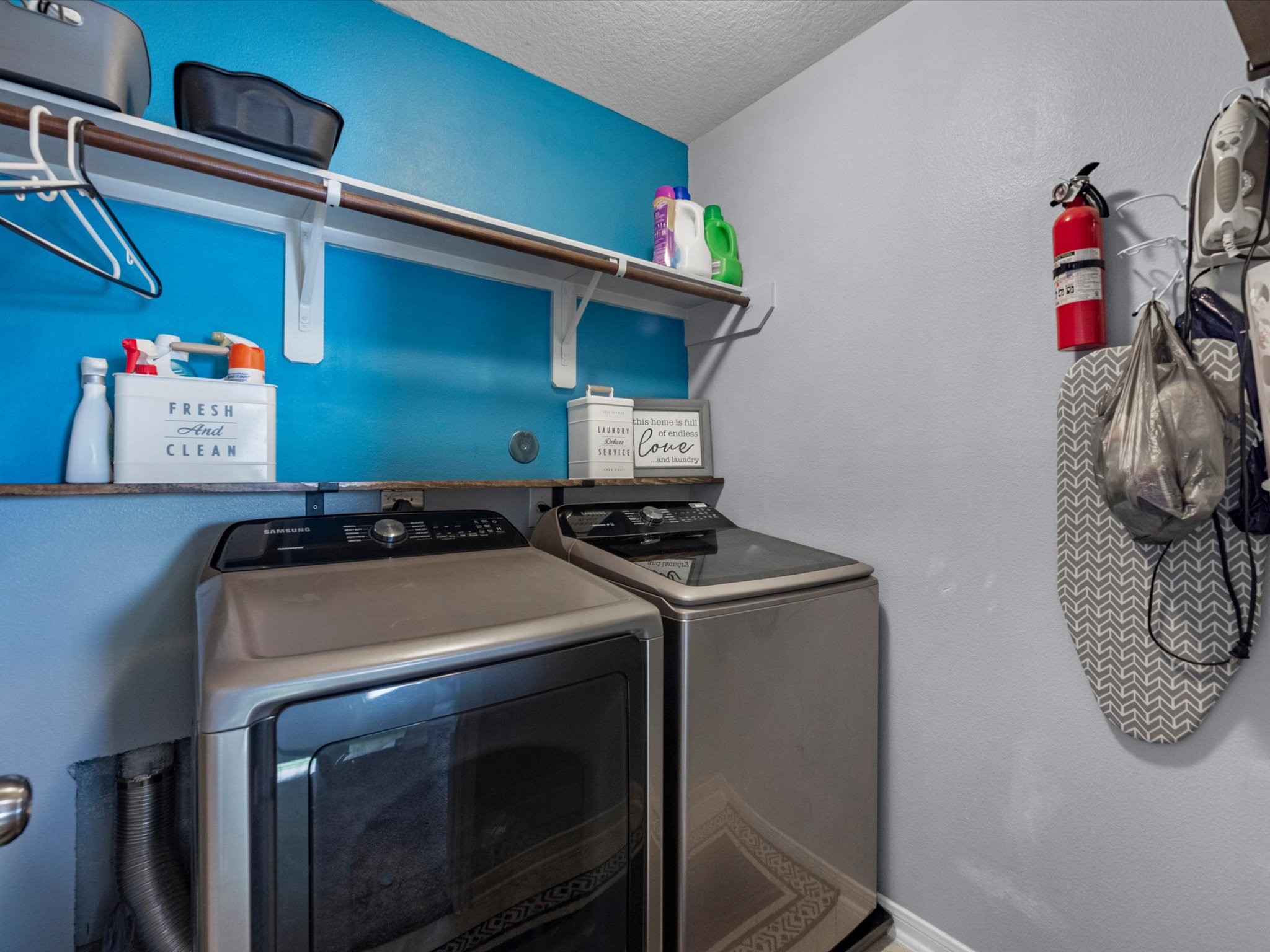 22422 Lamaster Lane Spring, TX 77373 - Photo 27 of 35 Laundry room with shelving for added storage.
