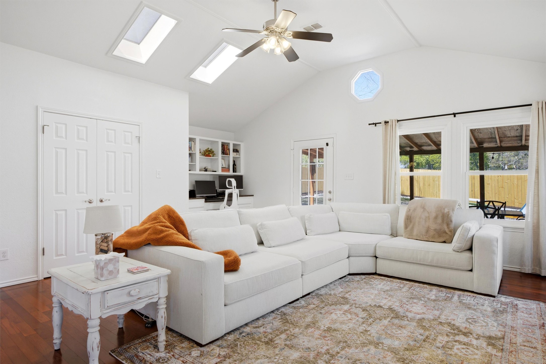 8804 Peppergrass Cove Austin, TX 78745 - Photo 16 of 39 a living room with furniture a ceiling fan and a rug