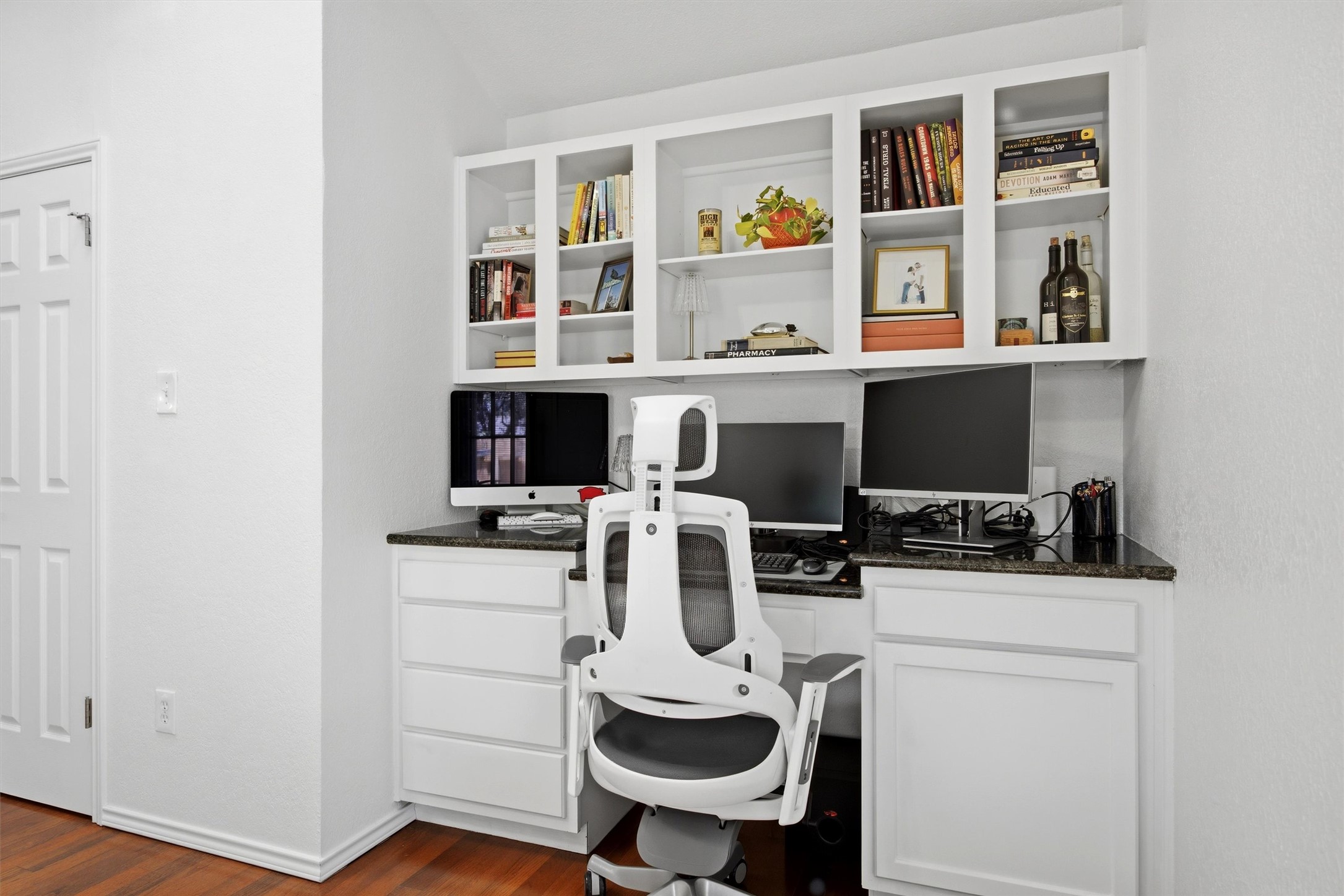 8804 Peppergrass Cove Austin, TX 78745 - Photo 20 of 39 a view of a workspace with furniture and wooden floor