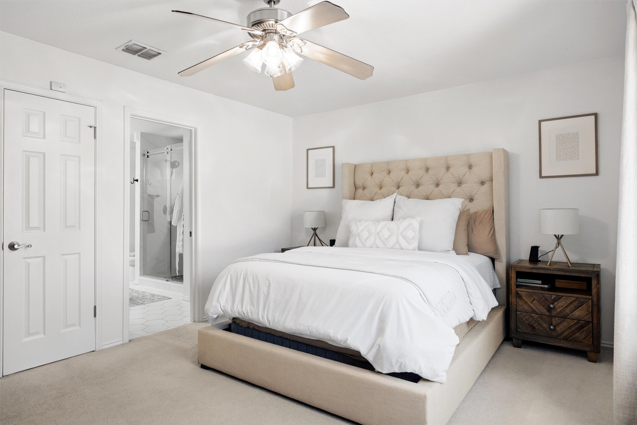8804 Peppergrass Cove Austin, TX 78745 - Photo 21 of 39 a spacious bedroom with a bed and a chandelier