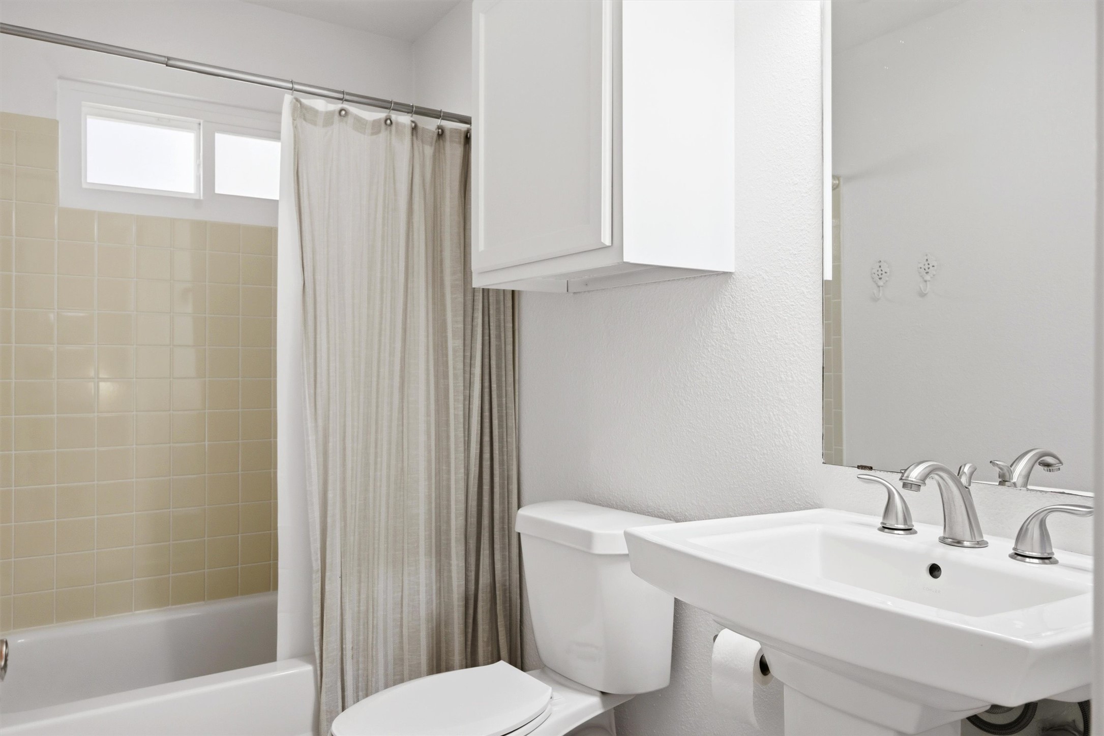 8804 Peppergrass Cove Austin, TX 78745 - Photo 32 of 39 a bathroom with a sink a toilet and shower