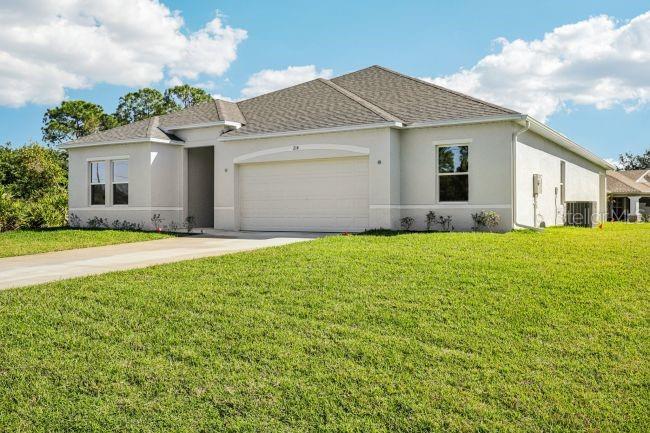 16492 Crane Road Weeki Wachee, FL 34614 - Photo 2 of 24 a front view of house with yard and green space