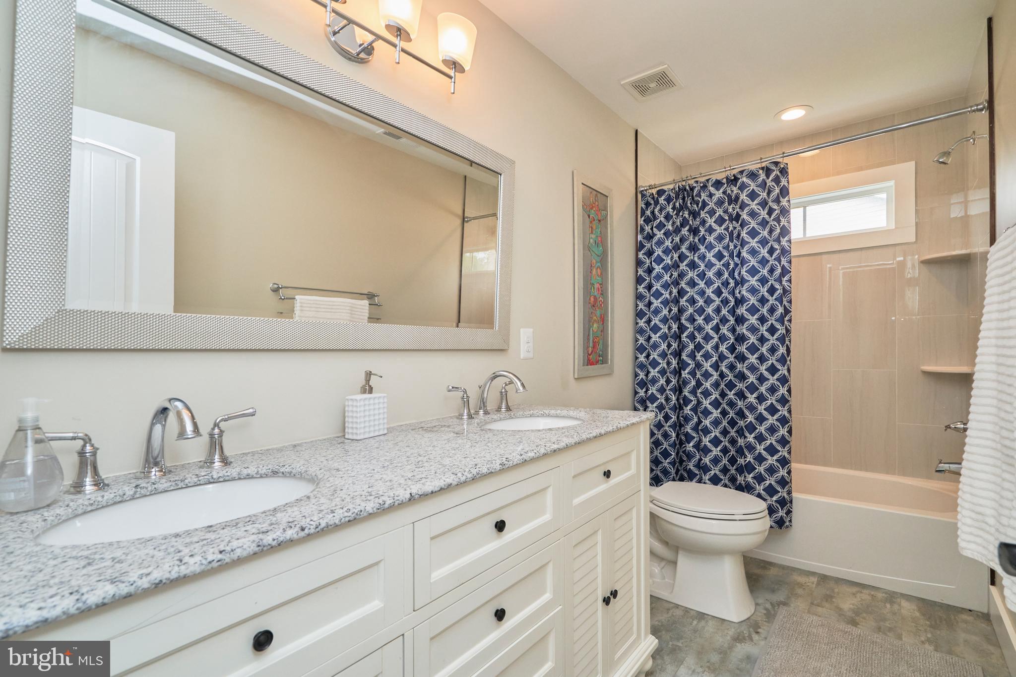 3117 Spring Drive Alexandria, VA 22306 - Photo 27 of 48 Hall bath is lovely - 2 sinks, upgraded tile