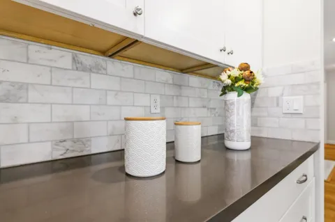 a bedroom with furniture and a large window