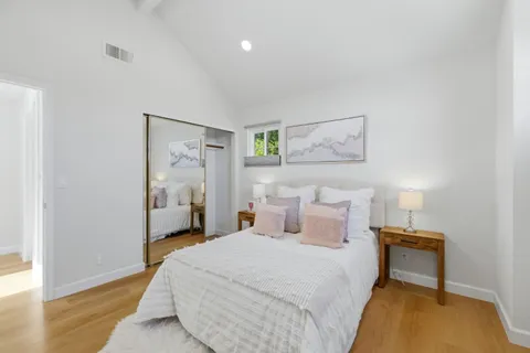 a bedroom with bed and a window