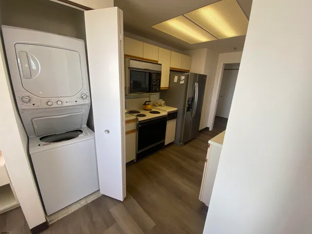 a kitchen with a stove and a refrigerator
