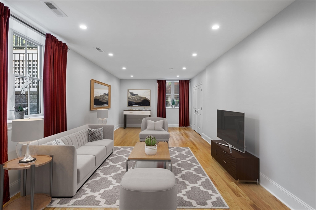 4 Coyne Road, Unit 4 Newton, MA 02468 - Photo 15 of 18 a living room with furniture and a flat screen tv