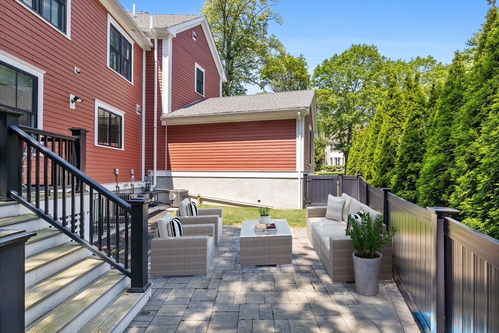 4 Coyne Road, Unit 4 Newton, MA 02468 - Photo 16 of 18 a view of a patio with couches table and chairs and potted plants