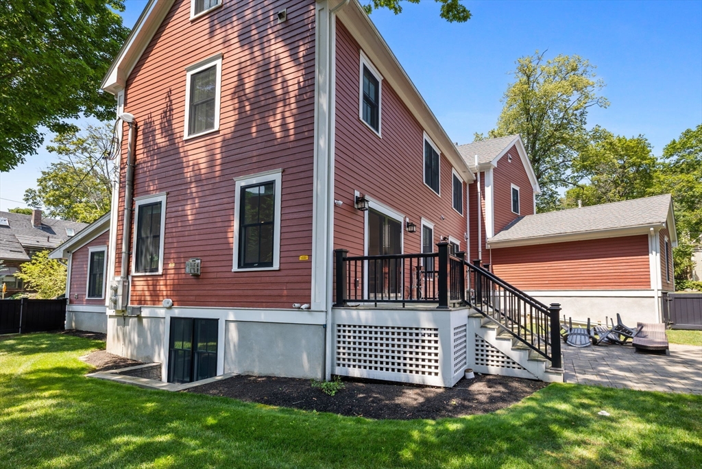 4 Coyne Road, Unit 4 Newton, MA 02468 - Photo 18 of 18 a front view of a house with a garden