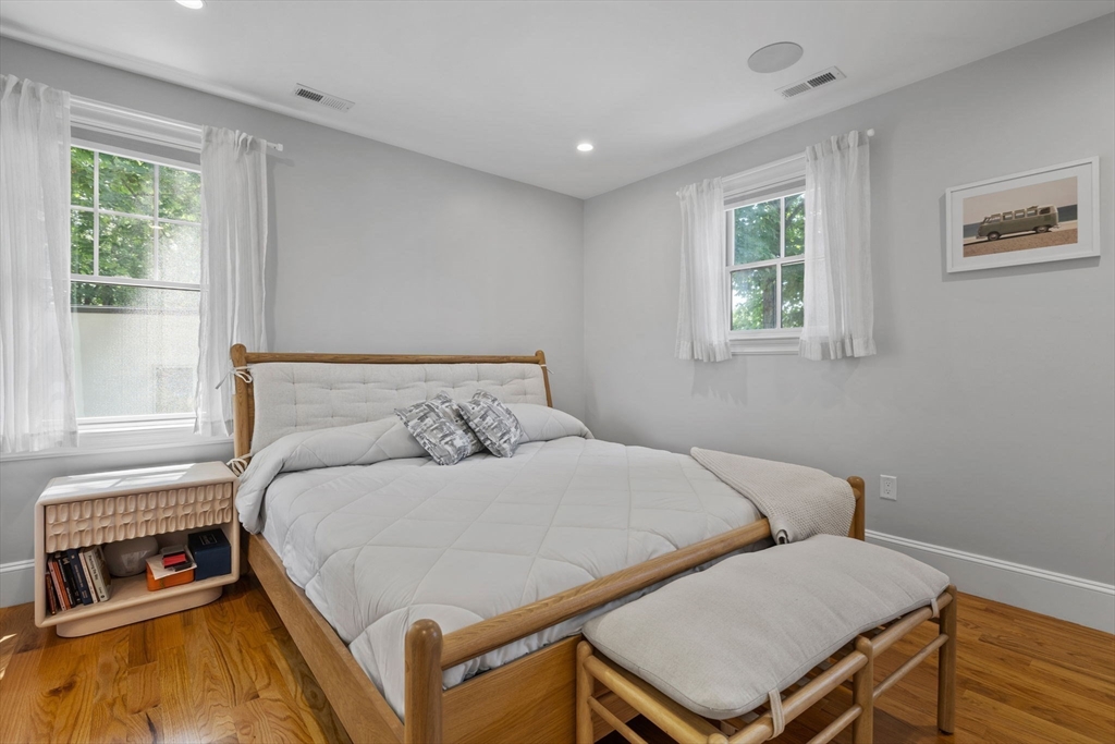 4 Coyne Road, Unit 4 Newton, MA 02468 - Photo 9 of 18 a bedroom with a bed and windows