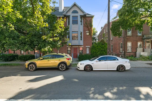 a car parked in front of a house