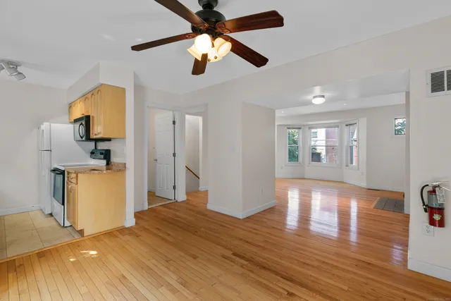 a view of a livingroom with wooden floor
