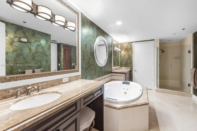 a bathroom with a granite countertop sink mirror and shower