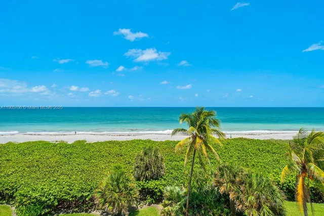 a view of a livingroom with furniture and a chandelier
