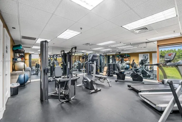 a green field with some trees in the background