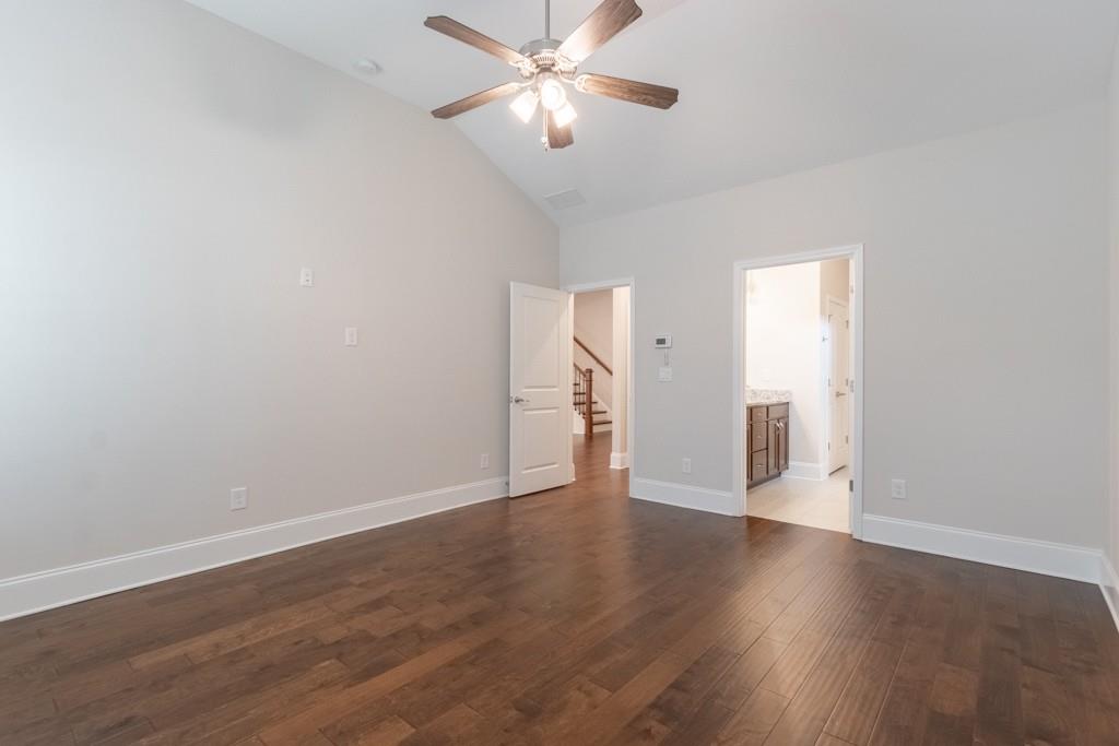 601 Cork Street Woodstock, GA 30188 - Photo 24 of 52 a view of an empty room with wooden floor